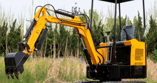 Mini excavator working on a modern construction job site