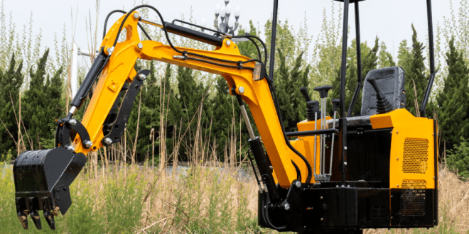 Mini excavator working on a modern construction job site